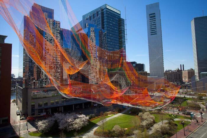 The vast net of rusty orange, magenta, and green hues will float above the Greenway until October. Dina Rudick/Globe Staff